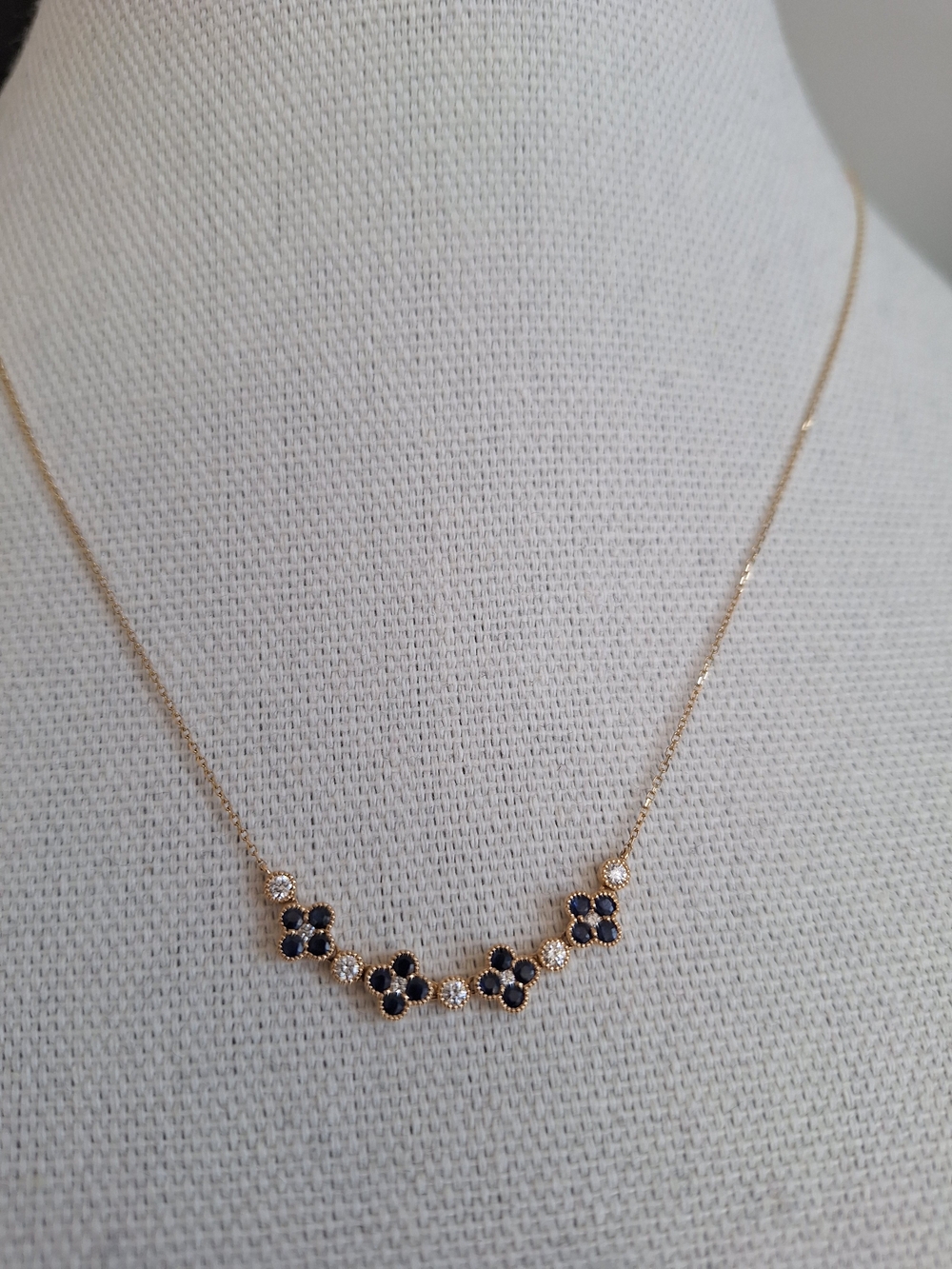Gold Necklace with Black Flower Accents by